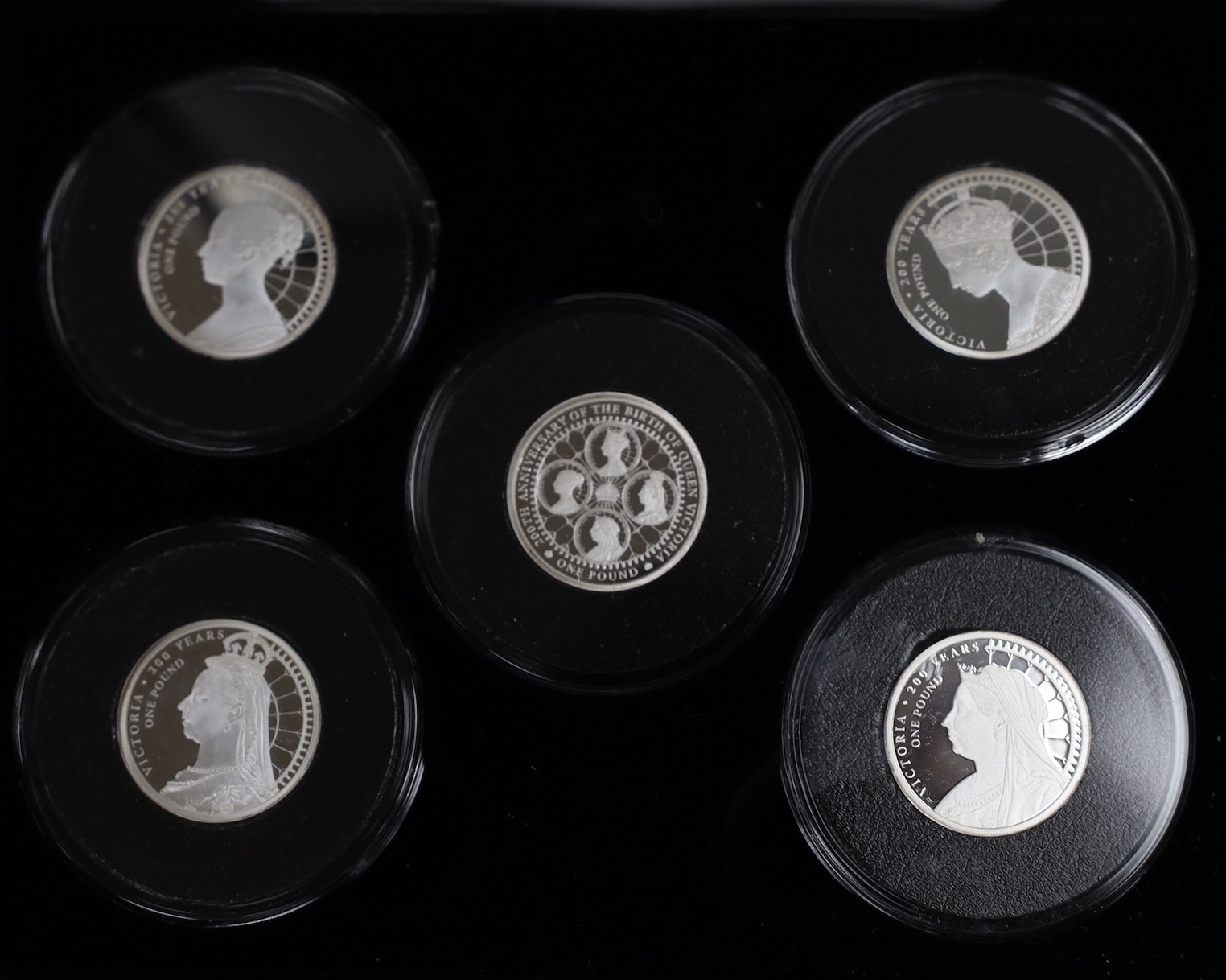 Five assorted silver proof sets.
